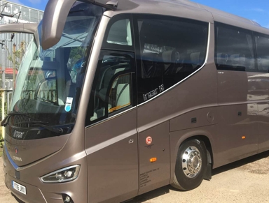 Exterior of a large bronze-coloured MET coach