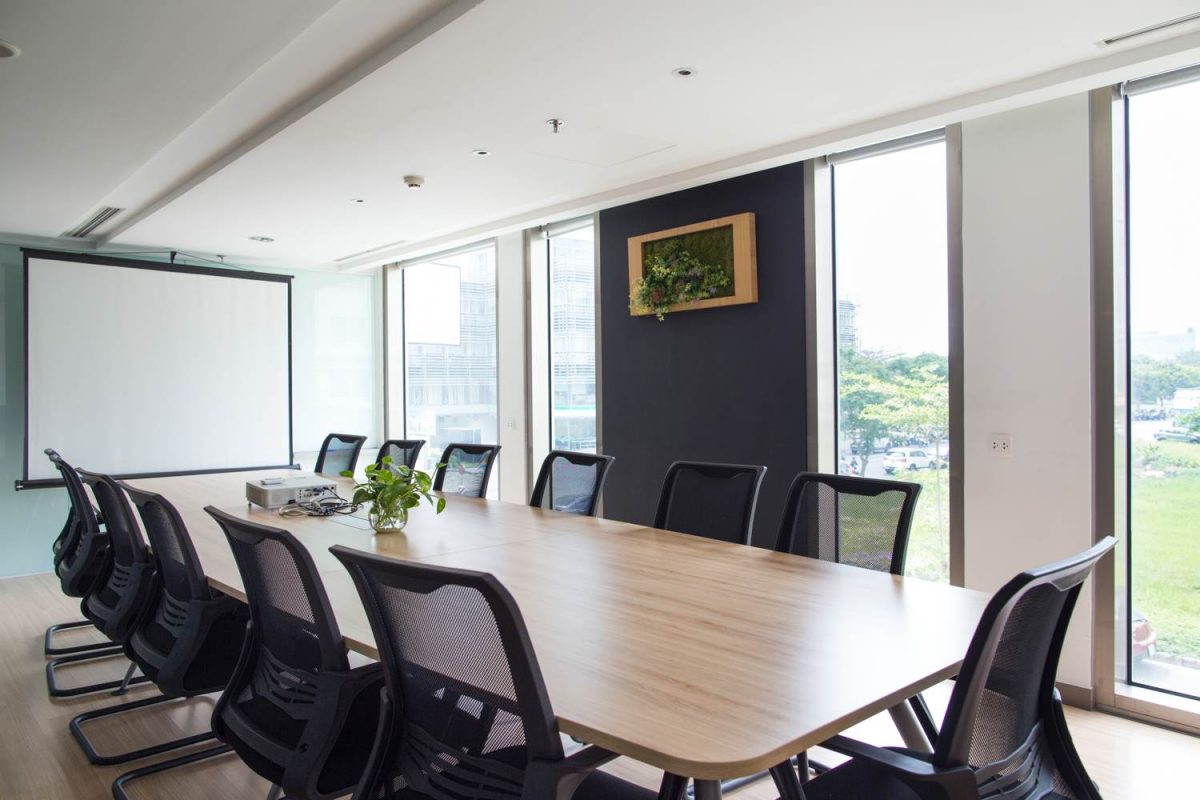 Conference room with a big table and 9 office chairs