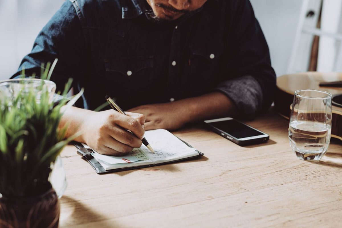 Man waiting in notebook - corporate events planning concept