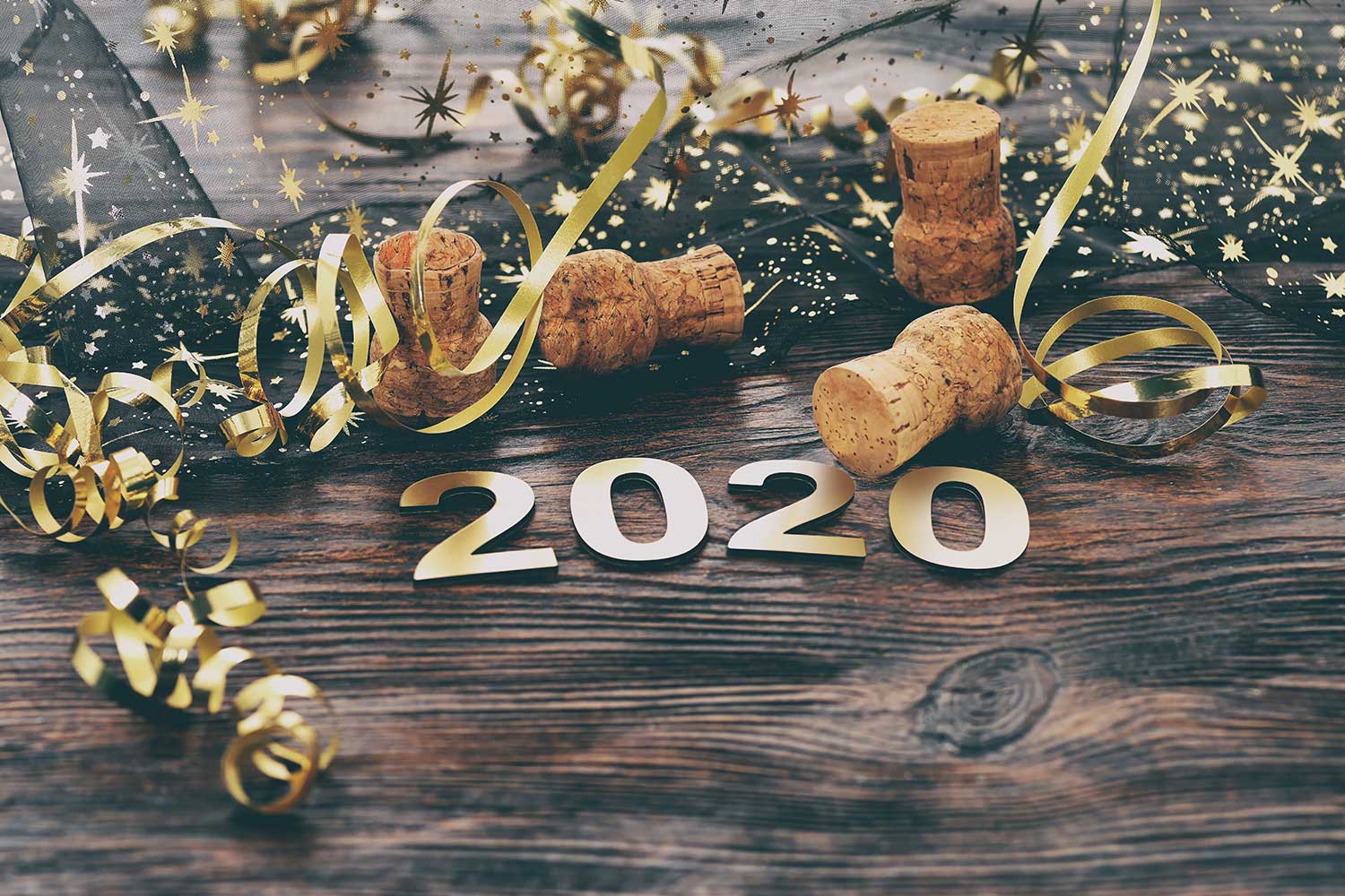 Happy New Year 2020. Symbol from number 2020 on wooden background