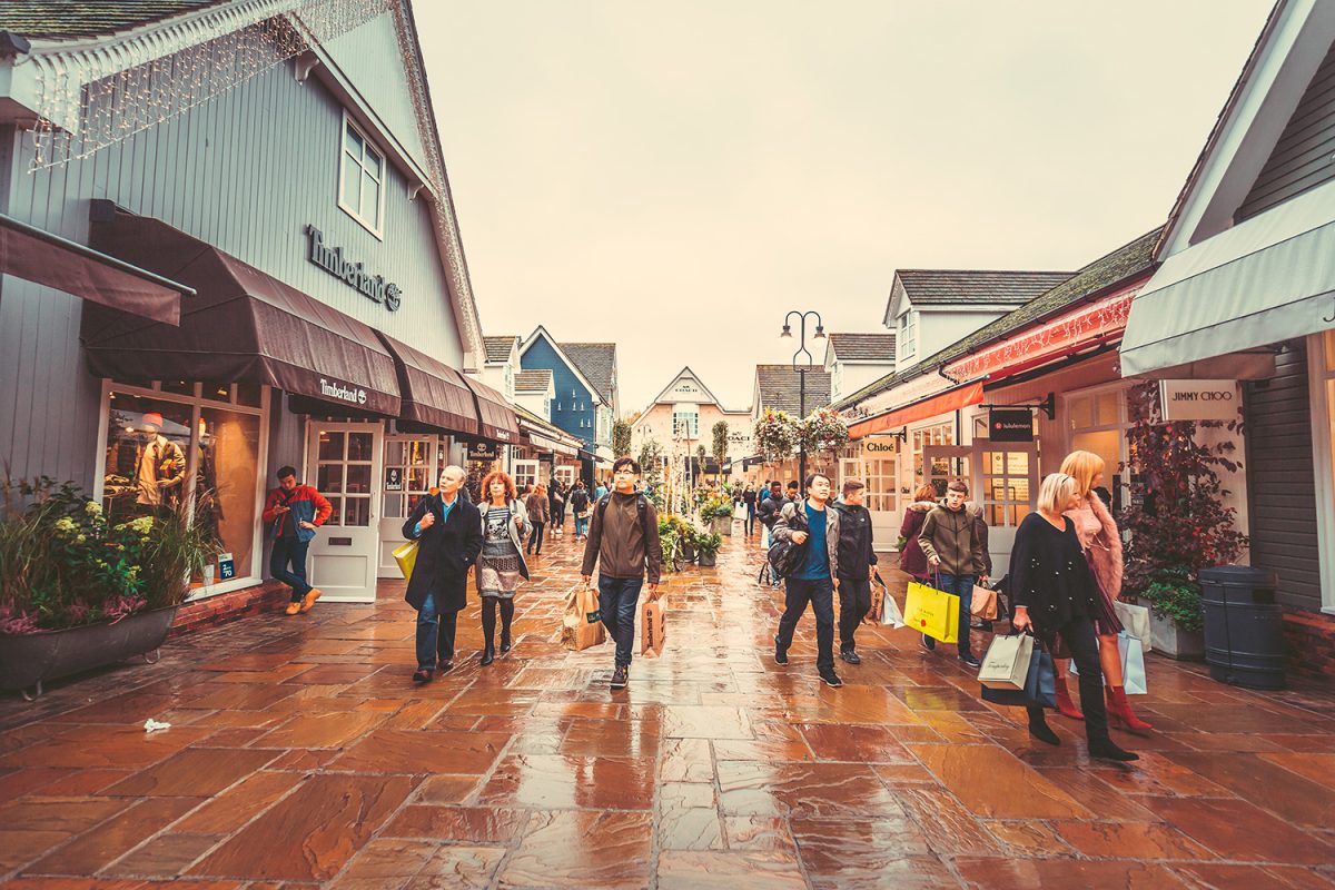 People shopping at bicester village shopping centre