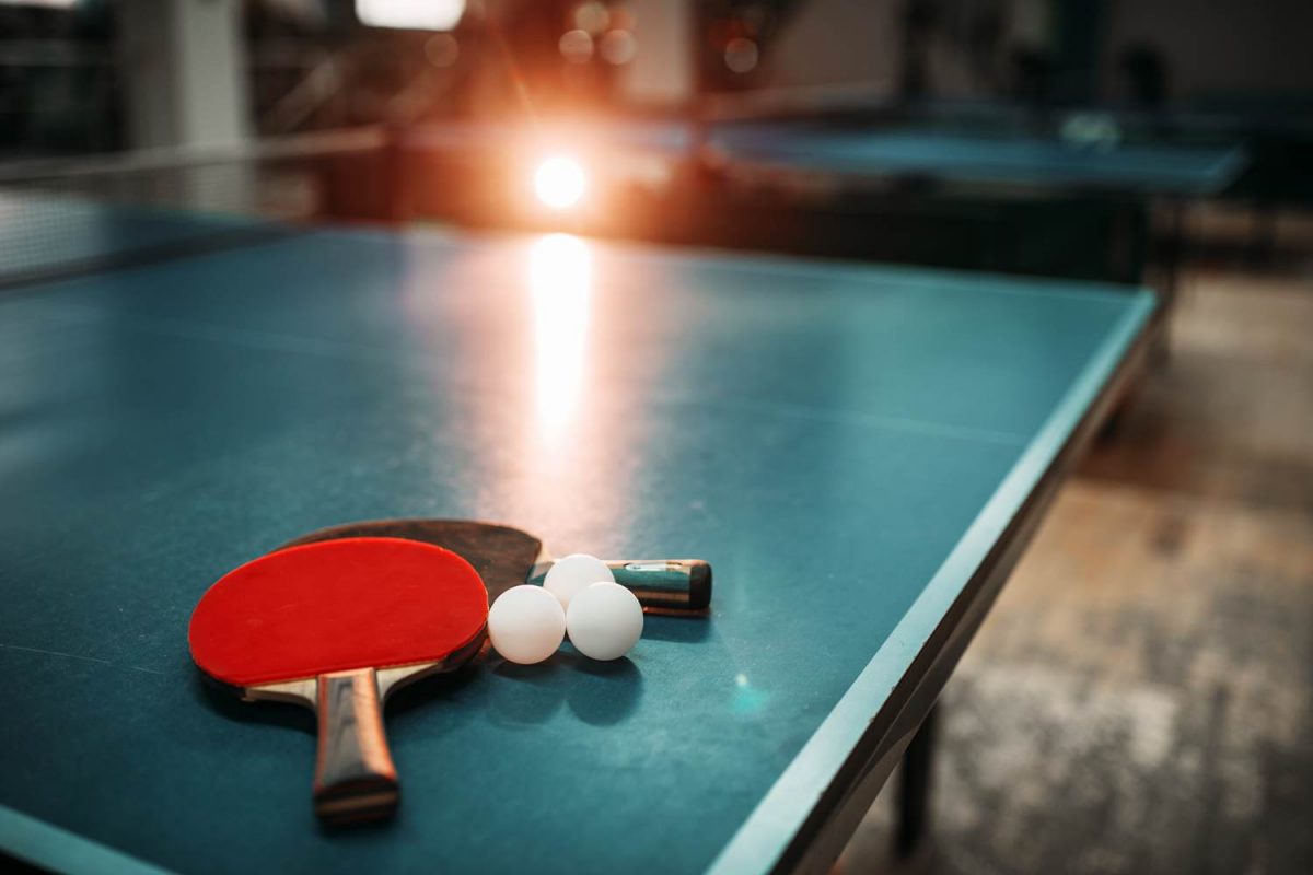 Ping pong table with paddles and balls