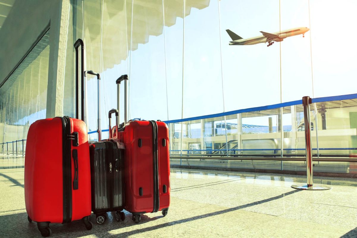 Red suitcases in airport hallway